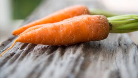 Close up Carrots on wood texture.の写真素材