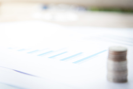 blurred coin with little plant growing business background concept.の写真素材