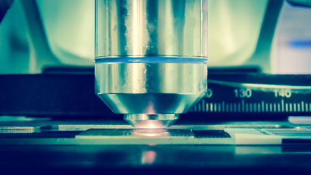 Close up microscope medical technology in blue tone.
