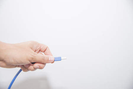 Close up hand hold usb port on white background.