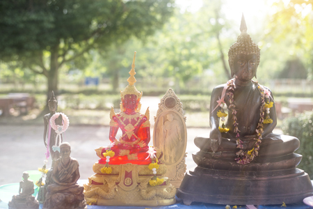 Close up Buddha statue on sun rise background.の写真素材