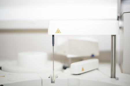 Blurred automate chemistry on white tone.Medical concept.