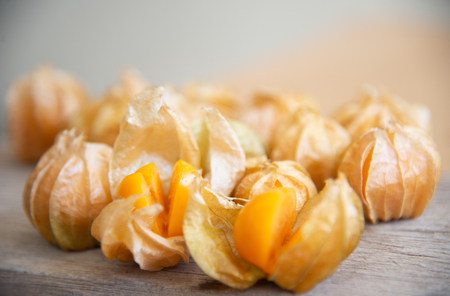 Yellow cape gooseberry fruit on wood texture.look like egg.の写真素材