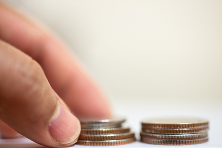 Close up Thai coin in hand save money concept.