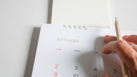 Hand writing and calendar on white tone.の写真素材