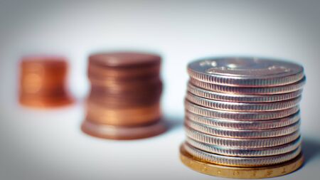 Group of coin on blurred background in saving money concept.の写真素材