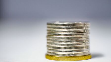 Group of coin on blurred background in saving money concept.の写真素材