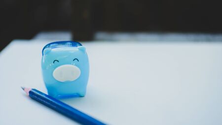 Blue pig and blue pencil saving money concept.の写真素材