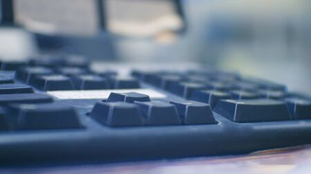 Blurred keyboard on blue tone technology concept.の写真素材