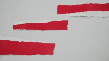 Red rip paper on white background free space.の写真素材