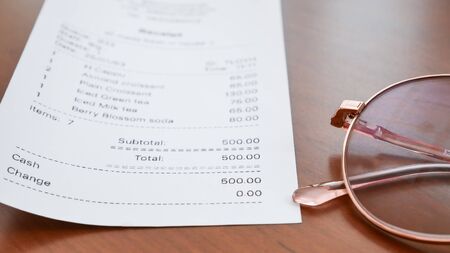 bill checking concept coffee in coffee shop.の写真素材