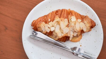 Close up freshly baked croissants on white plate, top viewの写真素材