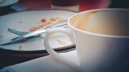Close up cappuccino Coffee heart shape in white cup.