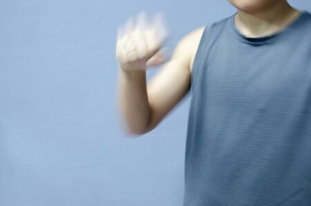 People stand on gray background.Exercise concept.の写真素材
