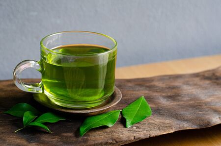 Fresh green tea on wood texture.の写真素材