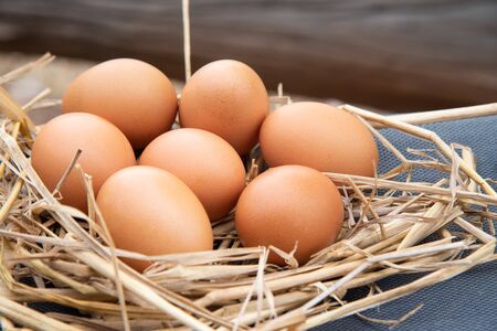 Close up Brown eggs on wood table.