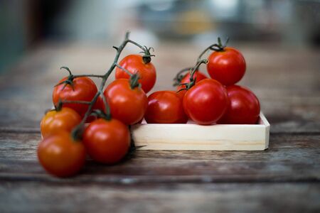 Close up fresh tomatoes  on wood table.の写真素材