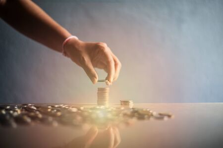 Group of coin with hand on stock concept.の写真素材