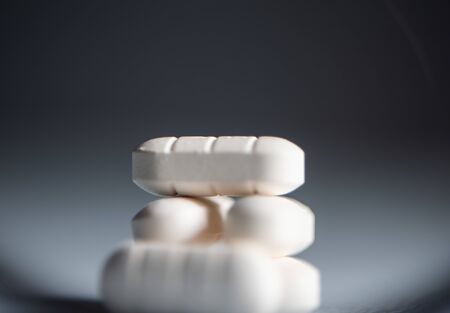 Close up white pills anti virus infection.