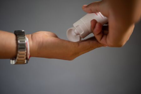 Close up hand using alcohol gel.Protecting coronavirus  or covid-19 concept.の写真素材