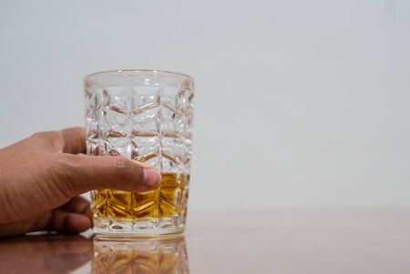 Close up whisky in cup on table alcoholic concept.の写真素材