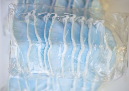 packing surgical mask N95 with protection corona orCovid-19 virus.Selling surgical mask concept.の写真素材