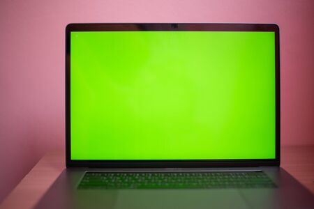 Close up laptop with green screen on table in work space concept.の写真素材