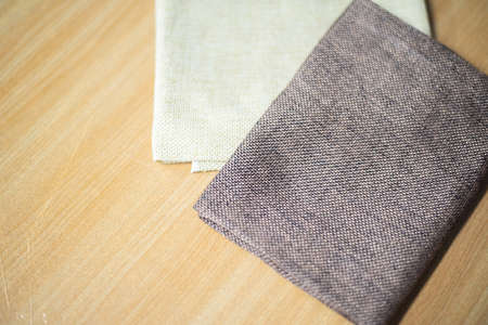 Group brown fabric on wood table.