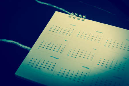 Blurred calendar in planning concept on black  background.