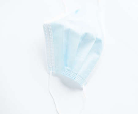 White Surgical mask virus protection on a white background.