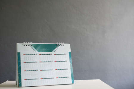 Close up old calendar on gray background.の写真素材
