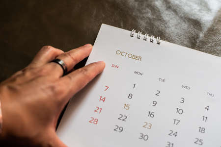 White calendar on leather background.in planning concept.の写真素材