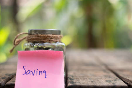 Coin on blurnbackground in saving money concept.の写真素材