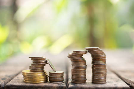 Coin on blurnbackground in saving money concept.