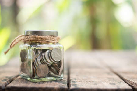 Coin on blurnbackground in saving money concept.の写真素材