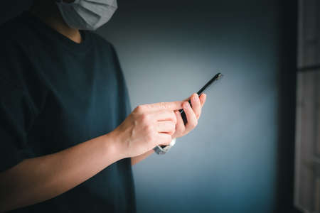 Business man using smartphone on blur background technology communication concept.の写真素材