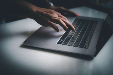 Blurred latop in dark tone technology concept.の写真素材