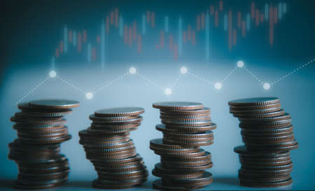 stacking coins with a graph of profit. Business successful growing.