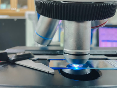 Close up objective lens of microscope in laboratory.