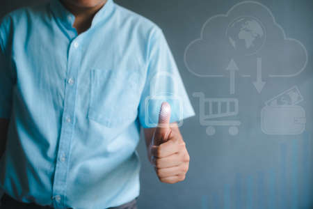 Business man scan fingerprint on gray background forensic and technology concept.