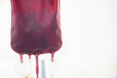 Blood bag in hand scientis blood bank laboratory.の写真素材