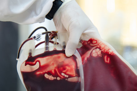 Blood bag with scientis in laboratory.の写真素材