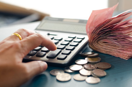 Money and calculator in saving growing money concept.の写真素材