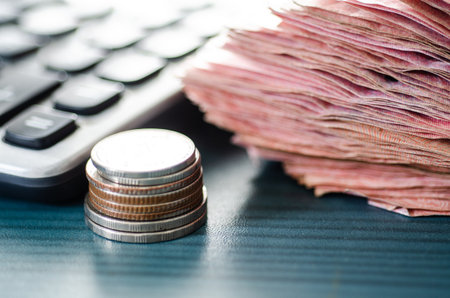 Money and calculator in saving growing money concept.の写真素材