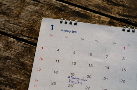 Old calendar page on wood background remember concept.の写真素材
