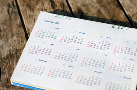 Old calendar page on wood background remember concept.の写真素材