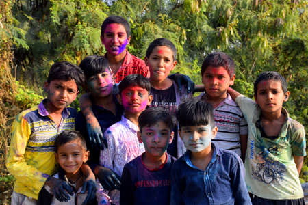 10-03-2020, Dawes, Madhya Pradesh, India,Rural children are playing in colors in happy posture, Concept for Indian festival Holiのeditorial素材