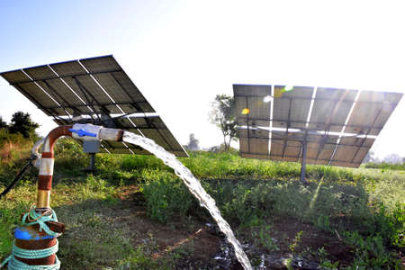 agricultural equipment for field irrigation, water jet, behind which is solar panel's,