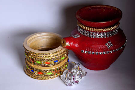 Bangle, nettle and beautiful pot made of clay for indian festival Karva Chauth.