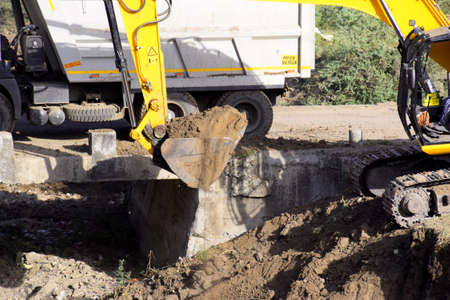 The modern excavator JCB performs excavation work on the construction site